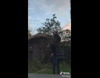 Teen girl black jacket spin bo staff