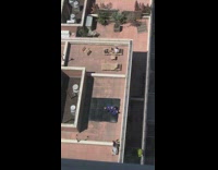 Two people purple martial arts uniform rooftop 