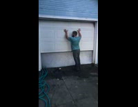 Guy walks through garage covered in bubbles