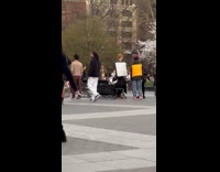 Man holding sign says I hate white people 