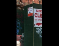 Pizzas Nailed to Construction Wall 