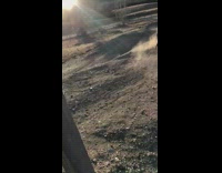 Biker hits something on dirt hill 