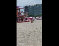 Neon pink bikini girl beach older guy 