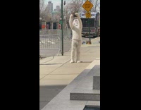 Man in white poodle costume being filmed