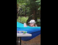 Grey hat blue hammock girl selfie drink