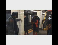 Guy and lady sing and play guitar at subway station 