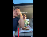 Mom and daughter eating Freddys inside the car 