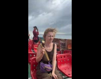 Wind Interrupts Lady to Eat Ice Cream