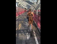 Dog rides on back of womans back while biking 