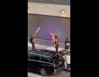 Collab IITW - Woman bikini violet light photoshoot on sidewalk