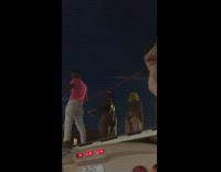 Three girls pink shirt guy brown bus