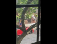 Blue graduation gown guy red sedan car