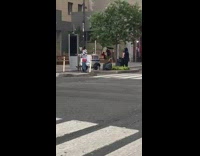 Guy dances by white NYPD cart rain 