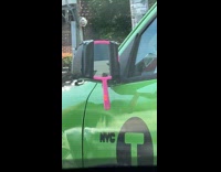 Hand mirror taped as side mirror of taxi