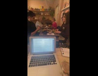 Curly girl drink from teacup shop laptop