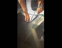 Guy quickly slips on high top sneaker 