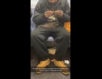 Brown beanie black jacket guy subway train 