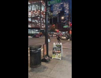 Man Rides Scooter on Top of Stacked Water Bottles