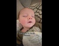 Baby tries to open eyes after drinking more milk 