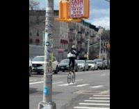 Collab WINY - Man ride tall bike on the street