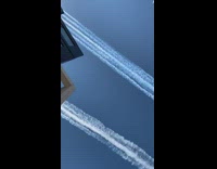 two pairs air force jets over building