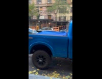 Man sleeps at truck parked on street
