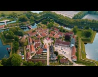 Collab PubityPets - Drones Hover Above Town on Symmetrical Artificial Isle