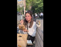 Woman eating french fry with squirrel 