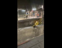 Woman as black widow does photoshoot on subway platform