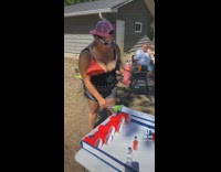 Woman balls alcoholic pinball 