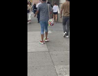 Girl wears purse and shoes covered in toys 