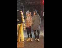 Two women winter clothes for camera crew photoshoot