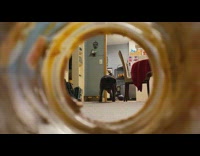 Black pug lick clean peanut butter jar