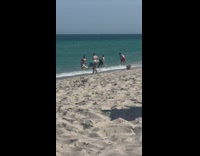 white boots beach shore self timer photo