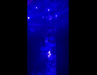 People in club sweeping rain flood