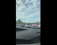 Gold SUV car white mattress roof freeway