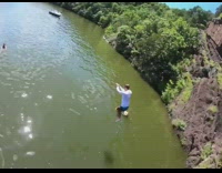 White long sleeve guy backflip off cliff 