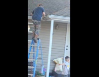 Man climbs the ladder then gets outbalanced