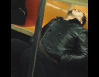 Guy falls asleep while sitting on subway floor 