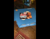 Guy open pizza box where mouse hides