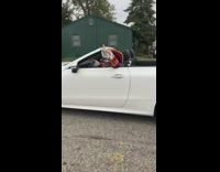 Captain Morgan drives white convertible Mercedes 
