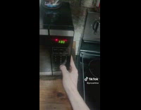 Microwave with bread set at one minute eighty seconds