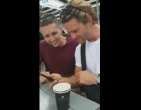 guy white shirt reaction to dpdt on phone