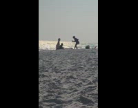 Girl touch couple lay sand silhouette windy