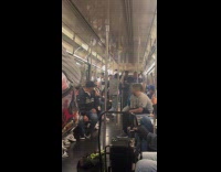 Yankees fan does hat trick on subway