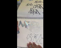 MF doom drawing in notebook pad reflective 