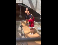 Woman chases bag for video at restaurant