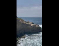 Girl film cardio workout on rock cliff