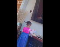 Little girl in dress braids look undone