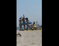 Guy two woman bubble gun beach dance
